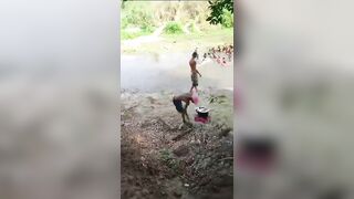 Man Smacks Woman with a Log and then Throws her into the River Venezuela (See Info)