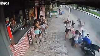 Motorcyclist loses Control and takes Everyone Out on the Sidewalk