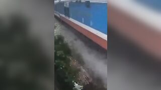 Vietnam: Man Drives onto the Train Tracks without Looking..