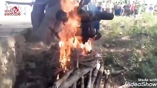 Hard to Watch Video shows 2 Men being Cooked over Raging Fire..Still Alive