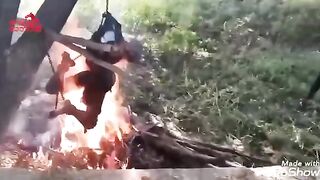 Hard to Watch Video shows 2 Men being Cooked over Raging Fire..Still Alive