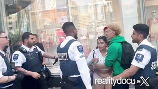 Wild scene at Yonge & Dundas where an argument turns into a fight combined with excha