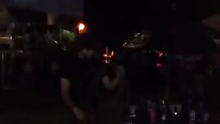 Dude throwing empty bottles into a crowd