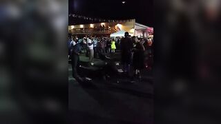 Dude throwing empty bottles into a crowd