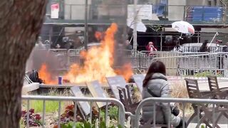 Alternate Footage of Trump Protester Setting Himself on Fire in NYC as Woman sits Down to Watch
