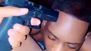 Violence Fetish..Girl Holds Loaded Extended Magazine Pistol to her Man's head during Oral Tradition