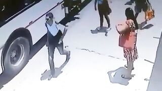 Man getting Off Bus trips, Falls and his Head Explodes