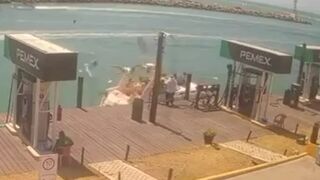 Boat Fueling on the Dock Explodes Sending the Kids Up and Out into the Water