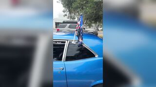 A man was asked to remove his American flag and Trump flag from his car