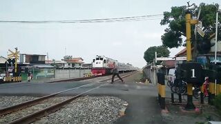 Indonesia: Grandfather in a Hurry tries to Outrun Train