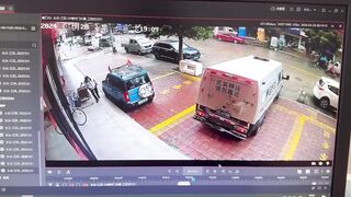 Only in China..Brinks Type Truck somehow Runs Over the Guard who Just got out of the Car