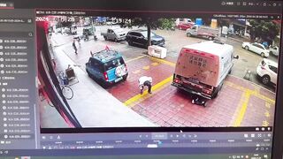 Only in China..Brinks Type Truck somehow Runs Over the Guard who Just got out of the Car