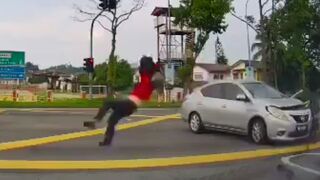 Malaysia: Motorcyclist gets a Wicked Ride from Collision