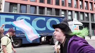 Green-Haired Trans Witch Has Meltdown Over “Trans Women Are Men” Sign