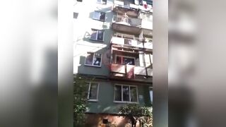 Drunk Russian vs. Railing That Looks Like It's Made with Parts Ordered off of Wish.