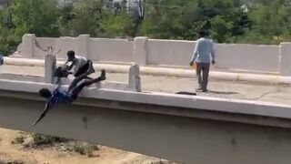 African Kid gets Thrown Off a Bridge during Fight and Lands in a Harsh Way