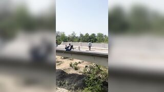 African Kid gets Thrown Off a Bridge during Fight and Lands in a Harsh Way