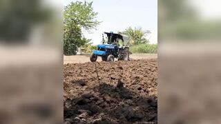 Another Indian Operating a Tractor