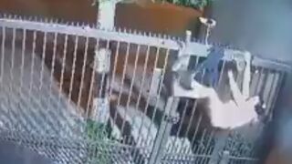 Ha: Girl trying to Rob House gets Pants Ripped Off by Fence...Puts her Hoodie on as Pants