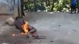 Strong Images: Meanwhile in Haiti the Killing Continues..Man Sprayed with Accelerant is Continuously Burned Alive as People Walk By