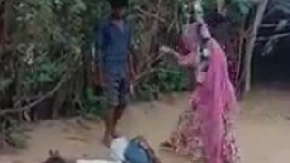 Indian Woman beats Tied Up Man with an Exe