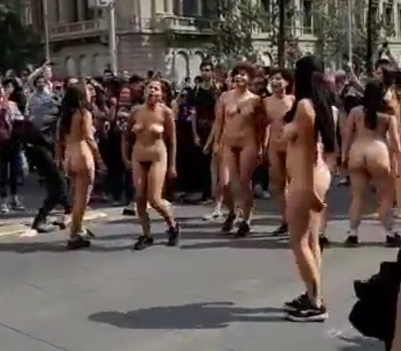 A Bunch of Naked Women and a Bizarre parade in Italy? Someone Shed some Light on this
