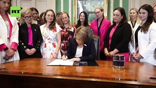 DEMONIC: Massachusetts Gov. Maura Healey Signs the Bill for Abortions up to Birth as White Liberal Woman Celebrate.