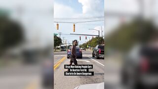 Another crazed black man in the streets of Charlotte attacking cars