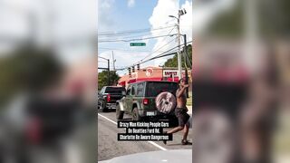 Another crazed black man in the streets of Charlotte attacking cars
