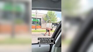 Another crazed black man in the streets of Charlotte attacking cars