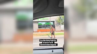 Another crazed black man in the streets of Charlotte attacking cars