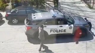 Female officer ran away as a man destroys her car and threw a stone at her