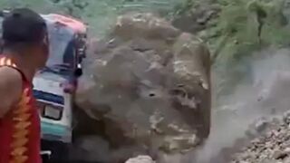 Massive boulder crushes stationary bus following a landslide in Nepal