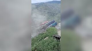 Massive boulder crushes stationary bus following a landslide in Nepal