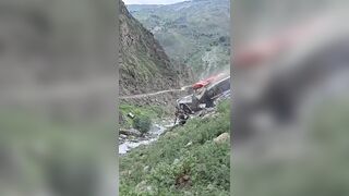 Massive boulder crushes stationary bus following a landslide in Nepal