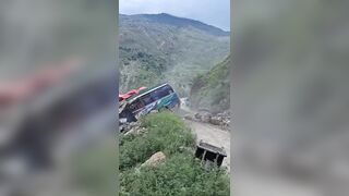 Massive boulder crushes stationary bus following a landslide in Nepal