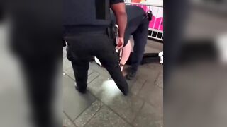 Man Detained and Tasered for Aggression Following Store Window Smash Attempt