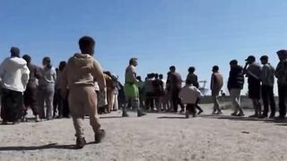 Jewish NGO clowns "entertaining" invaders in Dunkirk waiting to enter the UK.