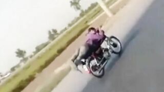 INDIA - Superman on Motorcycle is stopped abruptly by a Rickshaw