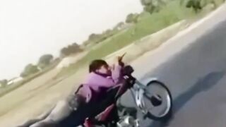 INDIA - Superman on Motorcycle is stopped abruptly by a Rickshaw