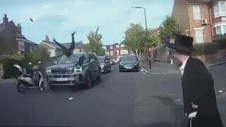 Motorbike collides with a car on a residential street in Stamford Hill