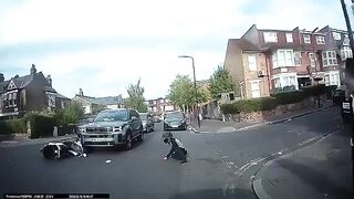 Motorbike collides with a car on a residential street in Stamford Hill