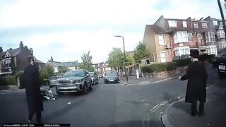 Motorbike collides with a car on a residential street in Stamford Hill