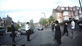 Motorbike collides with a car on a residential street in Stamford Hill