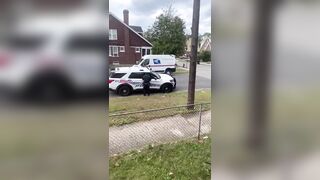 Crazy Black Man Tries To Steal Patrol Car While Carrying a Baby in His Arms