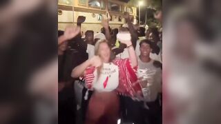 White Liberal Woman celebrates the invasion of thousands of African Men - with the invaders.