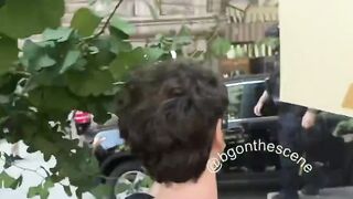 Chaotic scene in Minneapolis as Jake Lang rides in the bed of a pickup ttuck