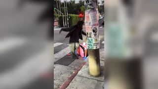 A homeless man was seen stealing food contents from a delivery robot in LosAngeles