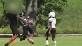 Man intentionally trips a youth football player as he was running into the end zone