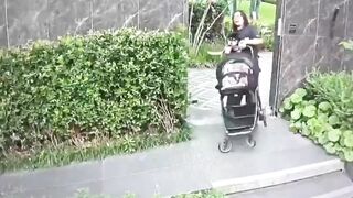 Mother Grabs Dog Over Stroller in Tense Encounter Clip